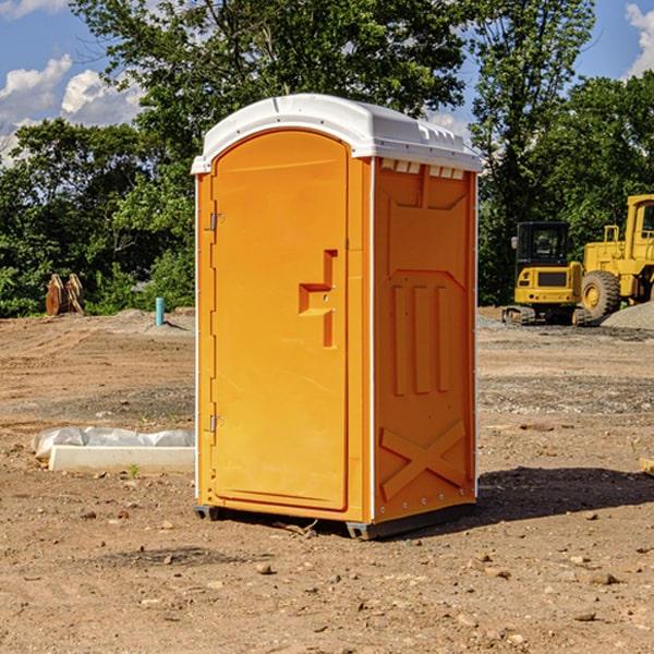 how often are the portable restrooms cleaned and serviced during a rental period in Scroggins Texas